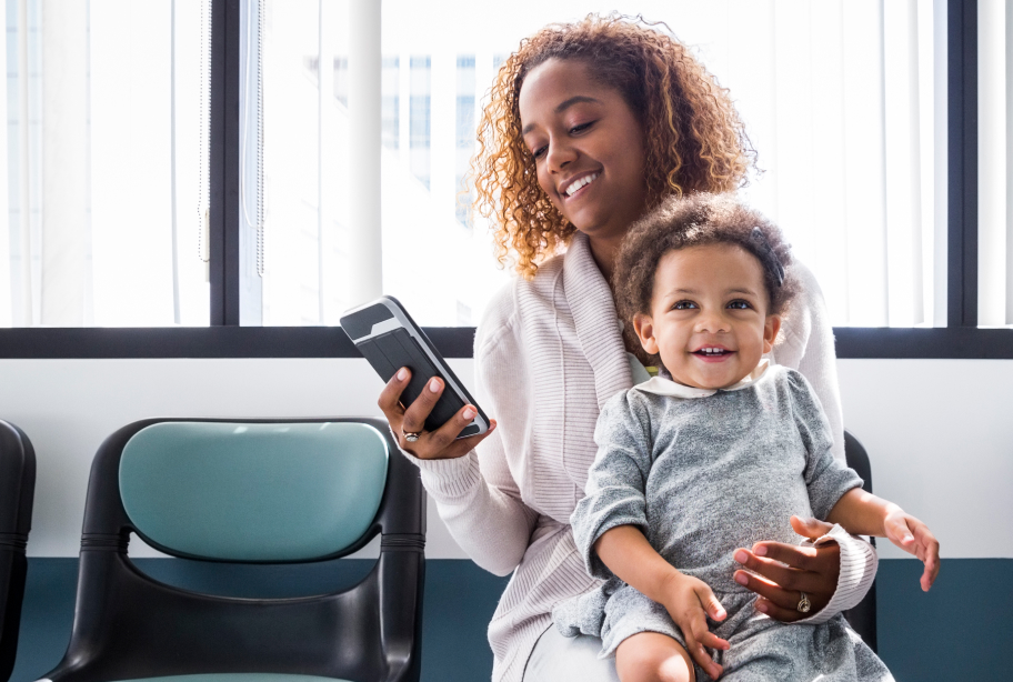 Woman with child and cell phone