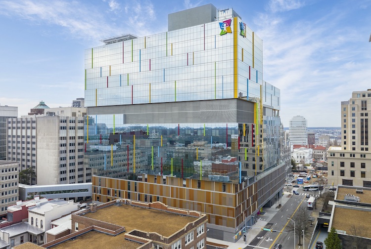 Image shows the Children's Hospital of Richmond at VCU's new facility on the outside, with a busy city street below.