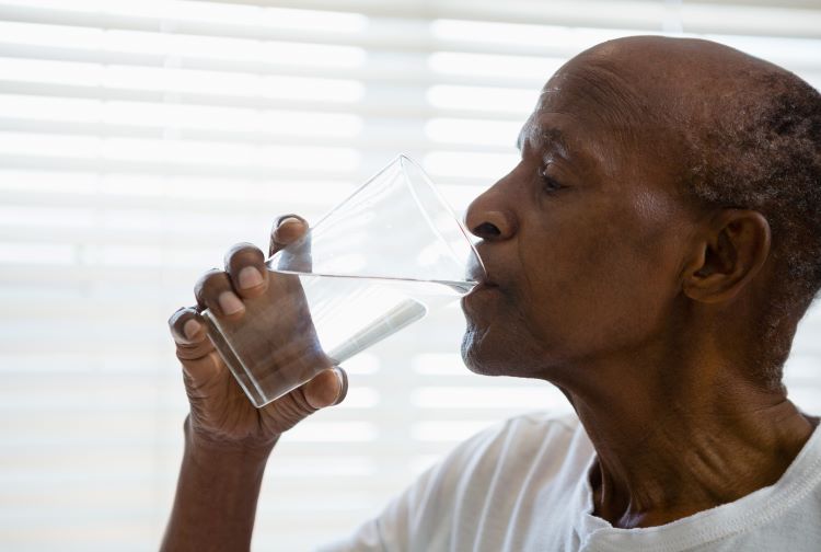 Black man drinking water