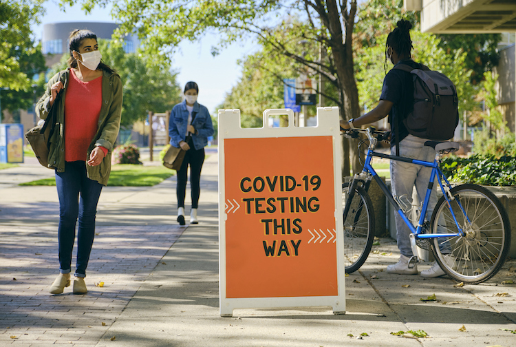 People entering and exiting a COVID-19 testing location.
