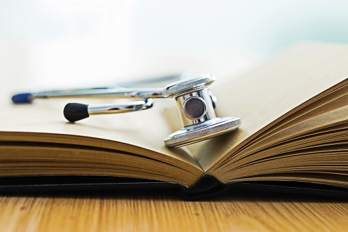 Stethoscope on pages of open book